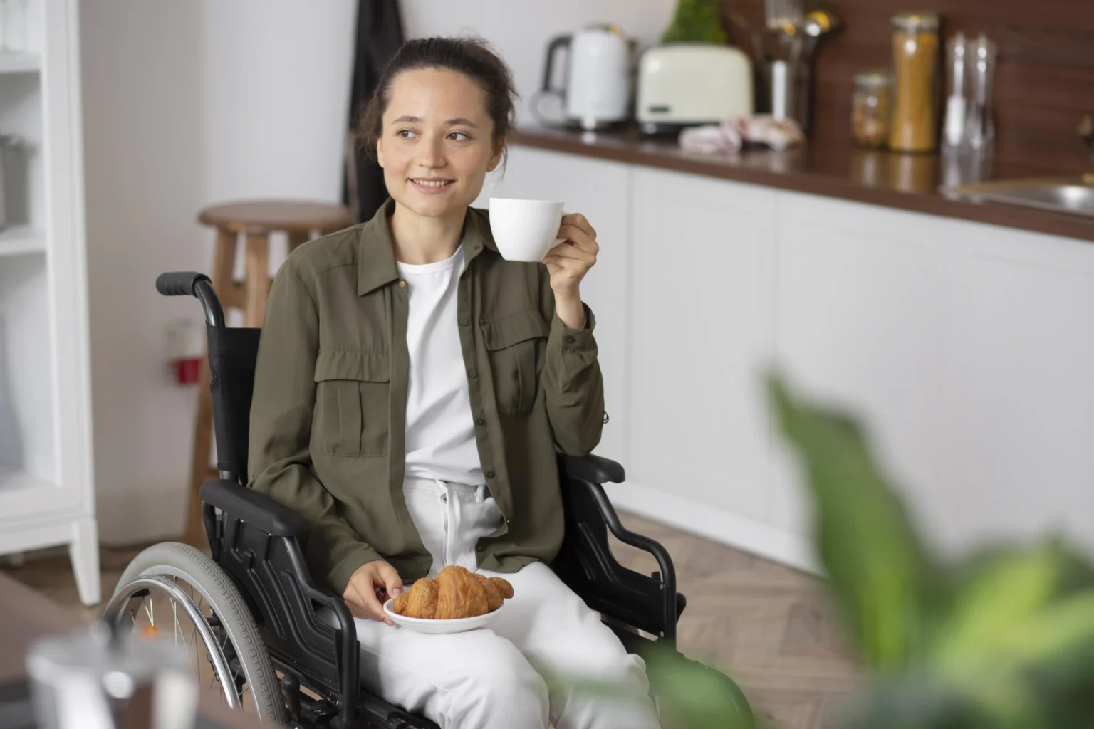 woman drinking coffee in a Supported Independent Living (SIL) home
